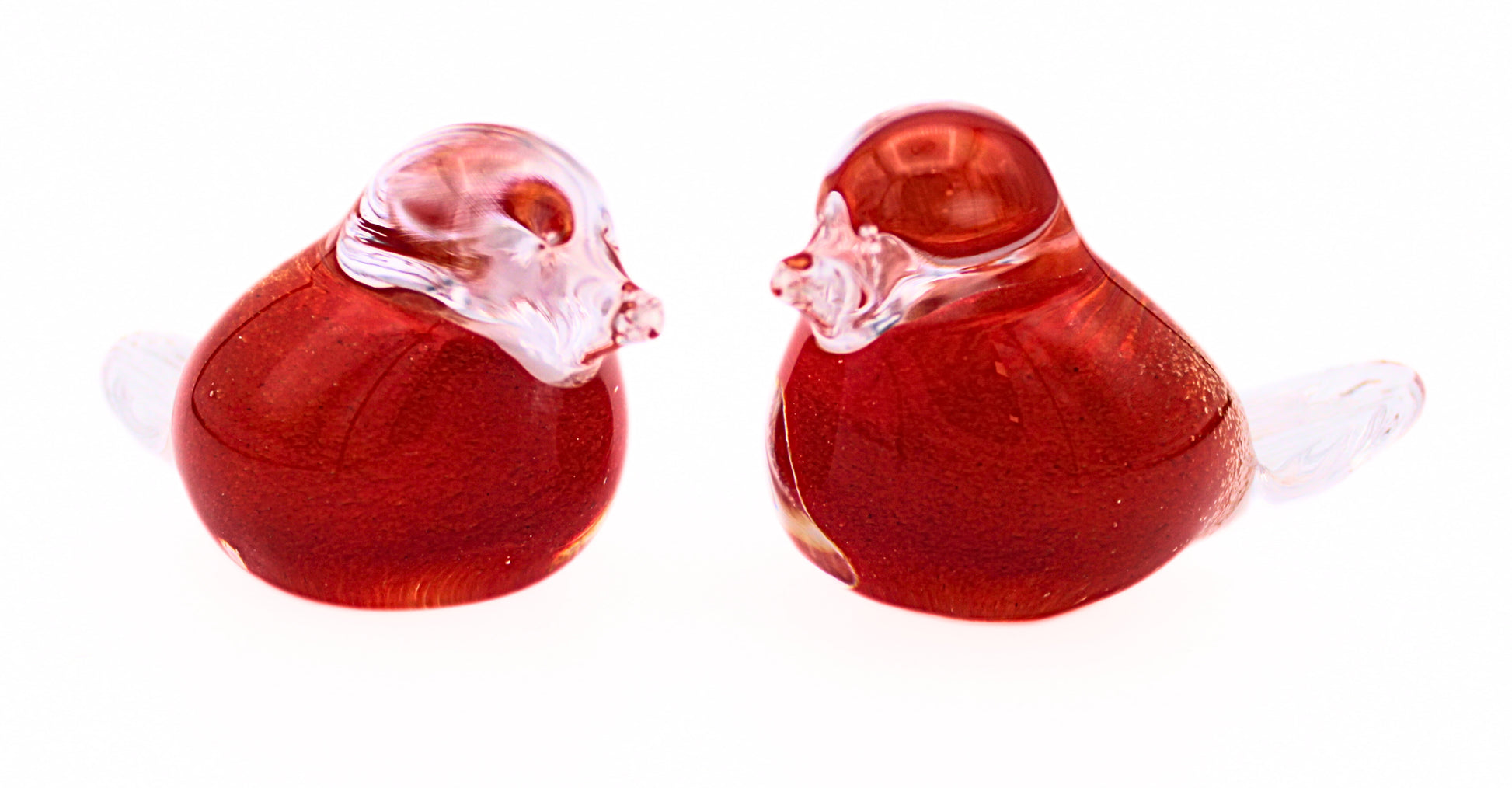Close-up view of pair of Glass Robin Redbreasts by the Irish Handmade Glass Company