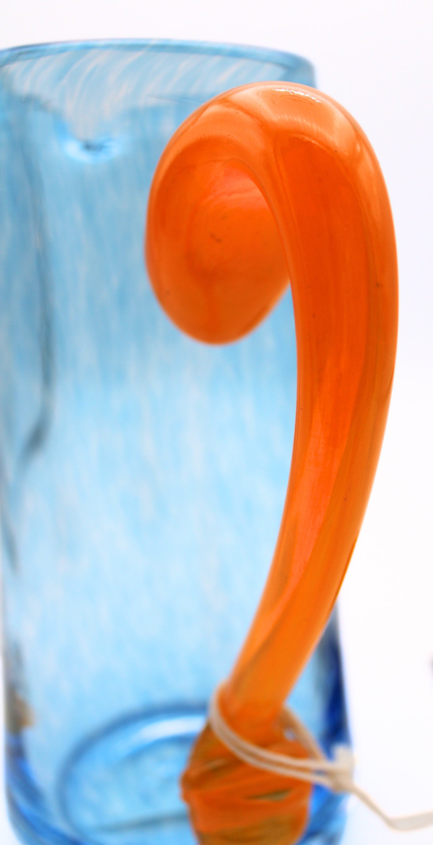 Close Up View of Orange Handle of Jerpoint Vase in Blue