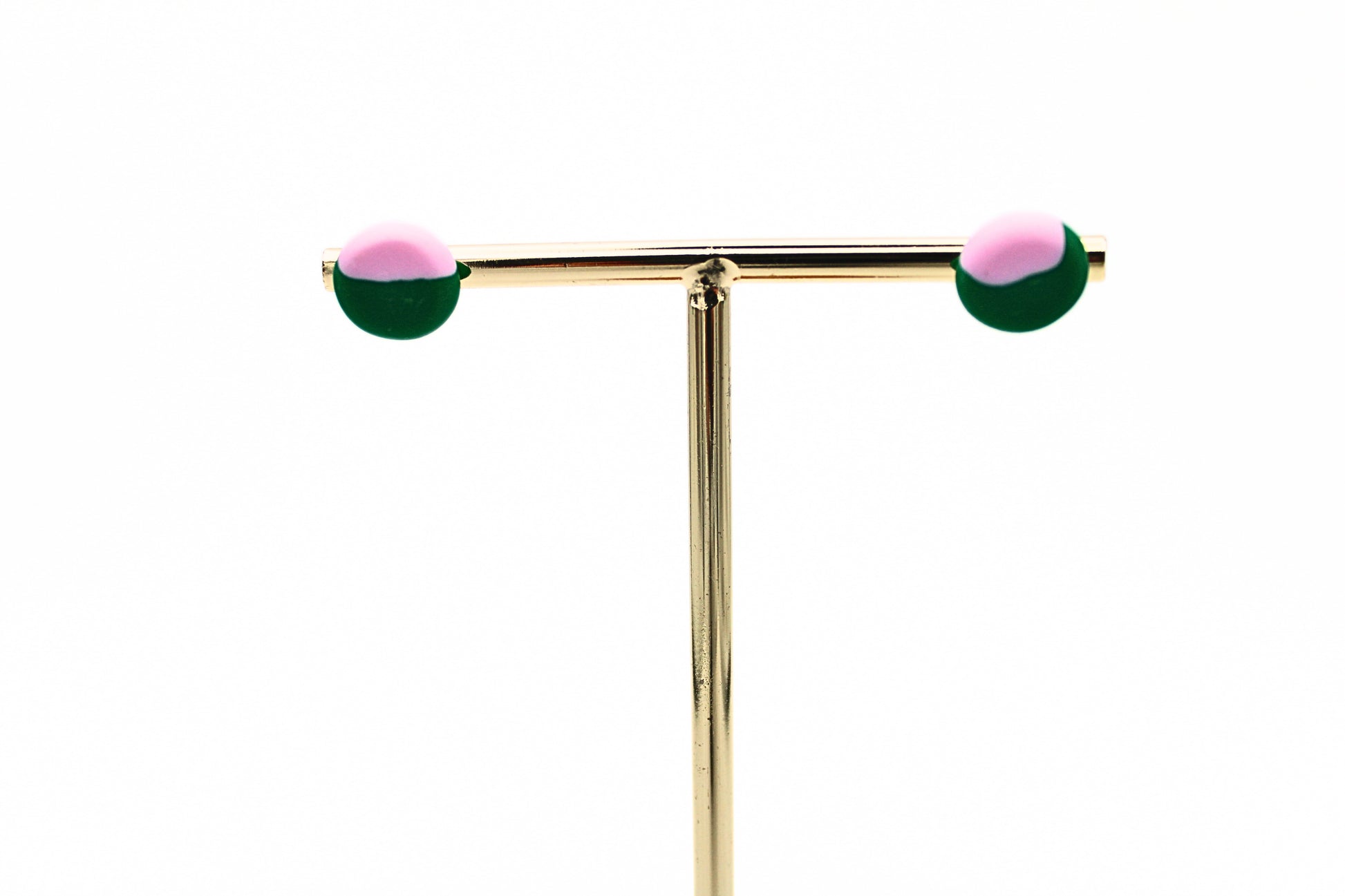 Punch+Fable Mini Stud Earrings in Green and Pink on Jewellery Stand